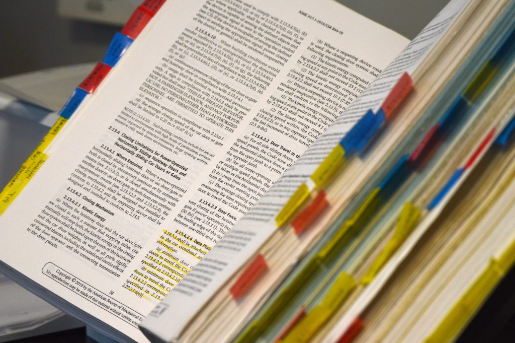 book of research with sticky notes